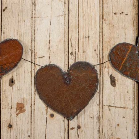 Three Rusted Steel Hearts Mounted on Wire design by Tish Bachleda